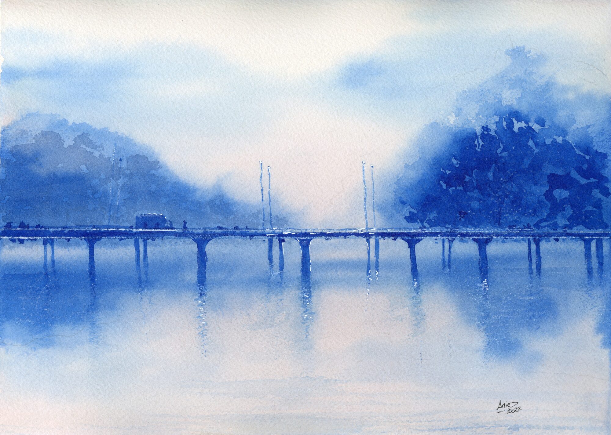 a misty blue river at dawn, a long bridge with cars crossing, woods on both banks